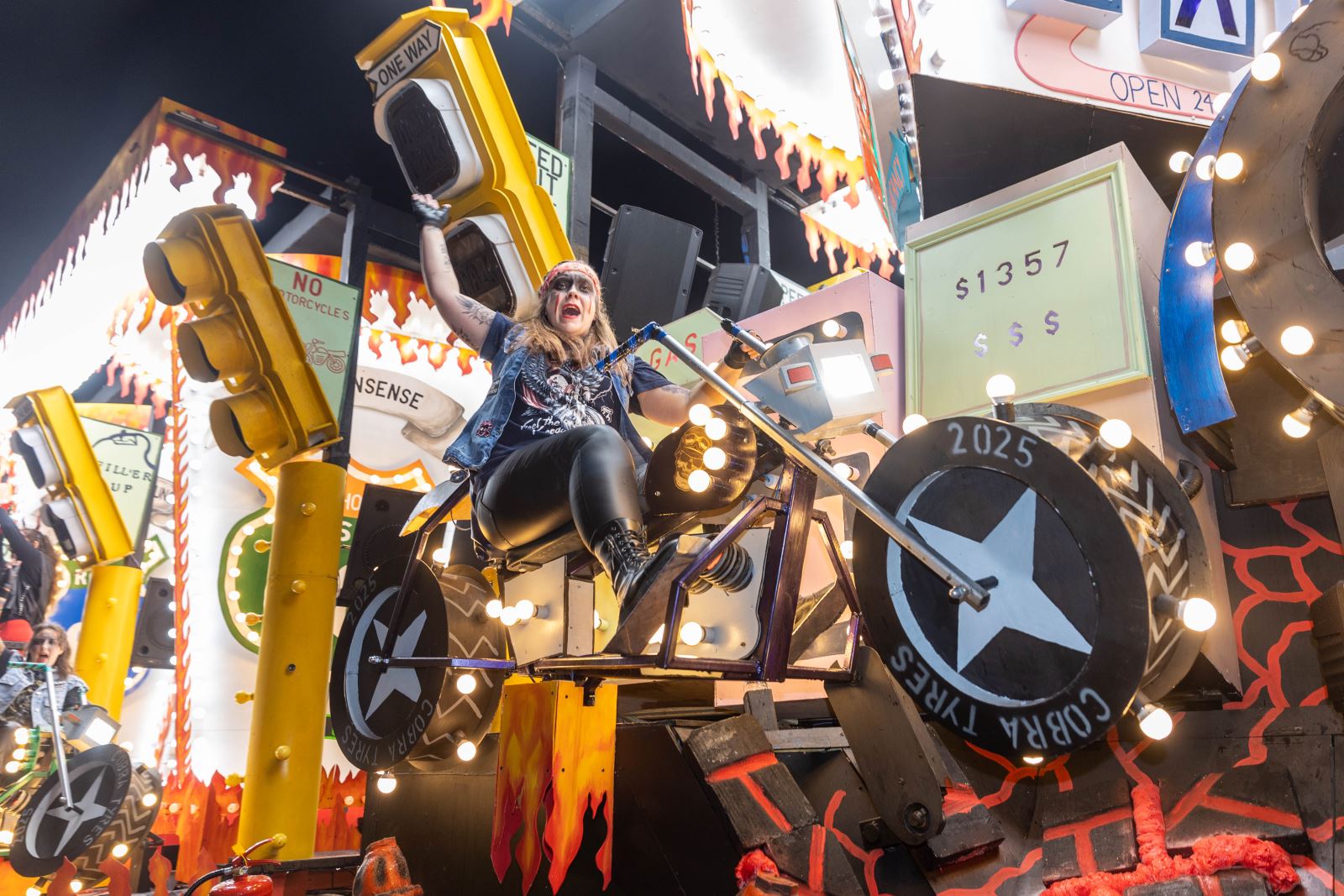 A motorbike-themed cart at the Weston-super-Mare Carnival featuring a Hell's Angel inspired biker riding a model motorbike